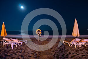 Night Beach, sand and sea views, umbrellas and sun loungers. Lifebuoy. Moon light. No body. coast and embankment Turkey Alanya