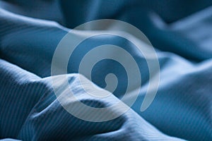 Night blue comfortable sheet on the sleep bed