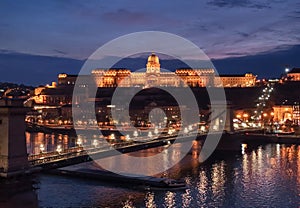 Night Buda Castle and Szechenyi Chain Bridge in Budapest, Hungary. Danube River