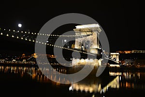 Night Budapest, Chain bridge on the Danube River, reflection of night lights on the water