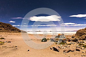 Night camp stars Salar De Uyuni salt desert Bolivia.