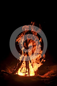 Night Campfire Bonfire in a beach shore, Dusk environment travelling in a black background