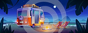 Night campfire on sea tropical coast with rv car