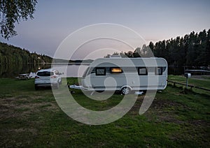 Night campsite camping caravan by lake Ragnerudssjoen in Dalsland Sweden beautiful nature forest pinetree