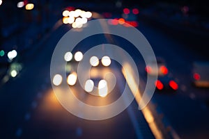 Night car traffic. car viewed from the road bridge in big modern city