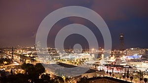 Night in the city of Barcelona in Catalonia, Spain. Columbus Monument and boulevard along Port Vell