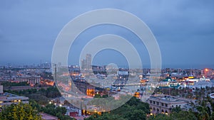 Night in the city of Barcelona in Catalonia, Spain. Columbus Monument and boulevard along Port Vell