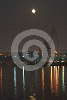 Night city with full moon