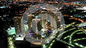 Night city landscape at downtown district. Buildings and traffic.