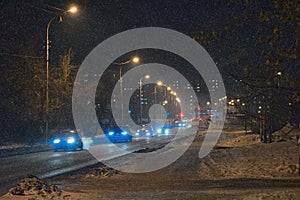 Night city landscape with street lights and urban traffic