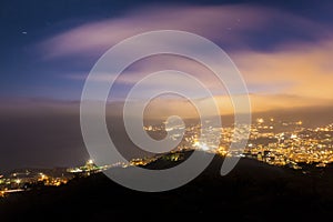 Night city light with clouds