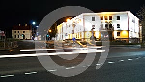 Night city light lines from cars. cars in highway with blur motion. Street view of the modern city at night. A lot of light from