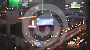 Night city lights and traffic in Bangkok as abstract background. Out of focus with blurry car and building light, bird eyes high a