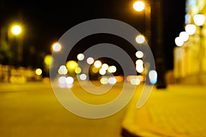 Night city street lights colorful bokeh background, darkness concept