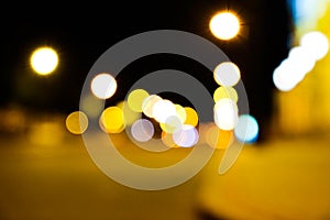 Night city street lights colorful bokeh background, darkness concept