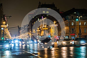 Night city traffic in a giant metropolis.City light bokeh background.Defocused night traffic lights.