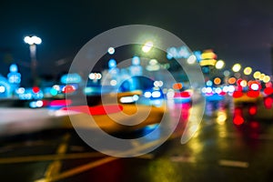 Night city traffic in a giant metropolis.City light bokeh background.Defocused night traffic lights.