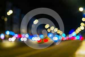 Night city traffic in a giant metropolis.City light bokeh background.Defocused night traffic lights.