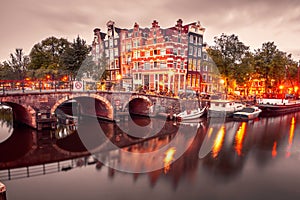 Night city view of Amsterdam canal and bridge