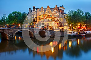 Night city view of Amsterdam canal and bridge