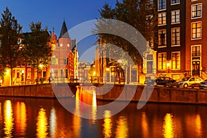 Night city view of Amsterdam canal and bridge