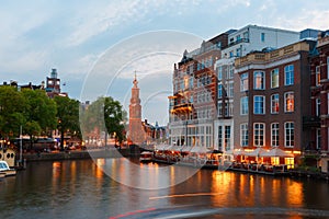 Night city view of Amsterdam canal and bridge