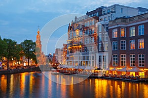 Night city view of Amsterdam canal, and bridge
