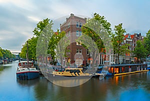 Night city view of Amsterdam canal and bridge