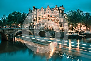Night city view of Amsterdam canal and bridge