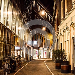 Night city view of Amsterdam channel and typical dutch houses, Holland, Netherlands.