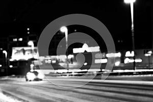 Night city view in blur. City Speed Traffic blurry photo. Street life bokeh image. Street view with traffic and cars defocused ima