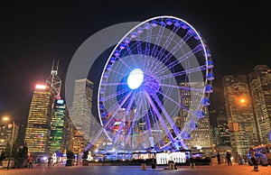 Night cityscape and ferris wheel Hong Kong