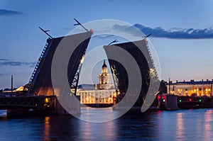 Night cityscape with river and bridge and ship in Saint-Petersburg.