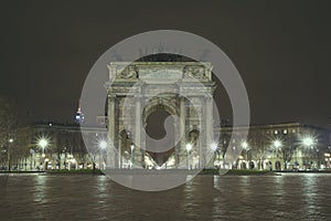 Night cityscape suggestive view of Arco della Pace in Milan