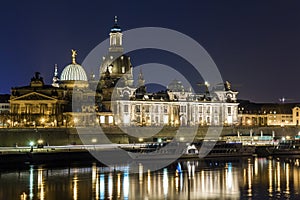 Night cityscape view of historic buildings with reflections in Elbe river in the center of Dresden & x28;Germany& x29;.