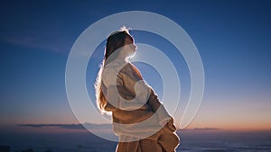 Night clubber dancing sunset at ocean beach closeup. Woman enjoying dance alone