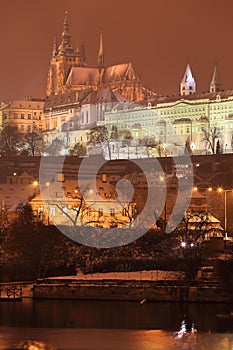 Night colorful snowy Prague gothic Castle, Czech Republic