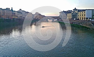 A night and day view of famous ponte vecchio bridge on the arno river florence