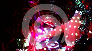 Night disco party concept. Light music disco ball on blue background. Rotating disco ball in nightclub with shiny