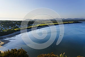 Night draws closer as the skies darken over Llanbedrog and its beach on the Welsh coast