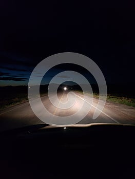 Night driving on a two lane rural road photo