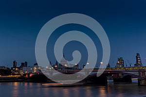 Night falling on St. Paul's cathedral and the Blackfriars bridge