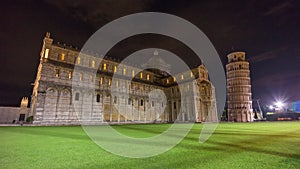 Night famous pisa cathedral and tower duomo square side panorama 4k time lapse italy