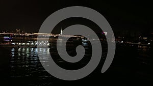 Night footage of cruise tour boats passing on Golden Horn part of Bosphorus strait in Eminonu area of Istanbul.