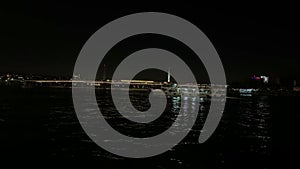 Night footage of cruise tour boats passing on Golden Horn part of Bosphorus strait in Eminonu area of Istanbul.