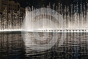 Night fountain, beautiful streams of water, light and music