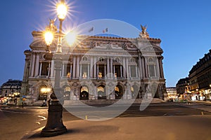 Night front view of the Opera National de Paris. Grand Opera is famous neo-baroque building in Paris.