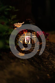 night garden lamp lantern candle fire light landscape single object in cemetery soft focus concept of vertical outdoors photo