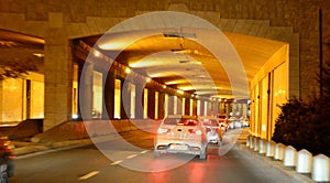 Night. Highway gold lightened tunnel. Jerusalem city.