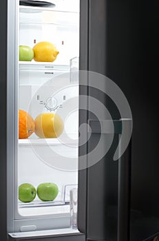 Night Hunger: fridge with fruits photo